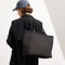 hover | Model holding The Lightweight Zip Tote in Night Song.