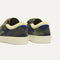 Close up of the heel of The Kids Strap Sneaker in Spruce Camo, with Rothy's signature blue halo. 