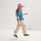 model | An alternate image of a child modeling The Kids Strap Sneaker in Spruce Camo. 
