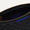 A closeup of The Wallet Wristlet in Night Song, focusing on the inner card slip.