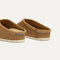 Close up of the heel of The Casual Clog in Wheat Rafia Knit, with Rothy's signature blue halo. 