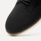 The toe and vamp of The Oxford in Black, in diagonal view.