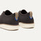 Close up of the heel of The Oxford in Deep Brown, with Rothy's signature blue halo. 