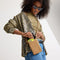 hover | Model wearing The Phone Crossbody in Hazelnut.