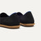 Close up of the heel of The Cruiser Loafer in Black Raffia-Knit, with Rothy's signature blue halo. 