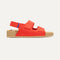 side | The Kids Double Strap Sandal in Firetruck Red shown from the side.