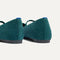 Close up of the heel of The Max Square Mary Jane in ReVelvet™ Everglade, with Rothy's signature blue halo.