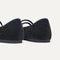 Close up of the heel of The Double Buckle Mary Jane in ReVelvet™ Black, with Rothy's signature blue halo.