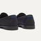 Close up of the heel of The Penny Loafer in Black, with Rothy's signature blue halo. 
