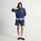 model | Alternate view of a model wearing The Penny Loafer in ReVelvet Navy. 
