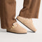 hover | Model wearing The Teddy Buckle Clog in Honey.