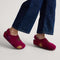 hover | Model wearing The Kids Clog in ReVelvet™ Fuchsia Burst. 