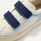 Close up of the vamp of The Kids Strap Sneaker in Blue Raspberry. 