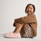 model | Alternate view of a child wearing The Teddy Kids Slipper in Sugar Cookie.