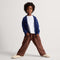 model | Alternate view of a child wearing The Teddy Kids Slipper in Oat Milk.