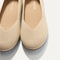 Close up of the toe and vamp of The Daily Flat in Ecru. 