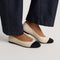 hover | Model wearing The Almond Ballet in Conch Captoe. 