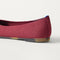 Close up of the heel of The Almond Ballet in Redwood, with Rothy's signature blue halo. 