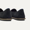 Close up of the heel of The Cruiser Loafer in ReVelvet Black, with Rothy's signature blue halo. 