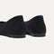 Close up of the heel of The Max Square Ballerina in Black Mesh with Rothy's signature blue halo.