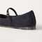 Close up of the heel of The Almond Mary Jane in ReVelvet Black, with Rothy's signature blue halo. 
