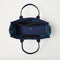The Classic Tote in ReVelvet Peacock, shown from above, with the interior exposed.