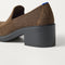 Close up of the heel of The Block Heel Loafer in ReVelvet Dark Herringbone, with Rothy's signature blue halo. 