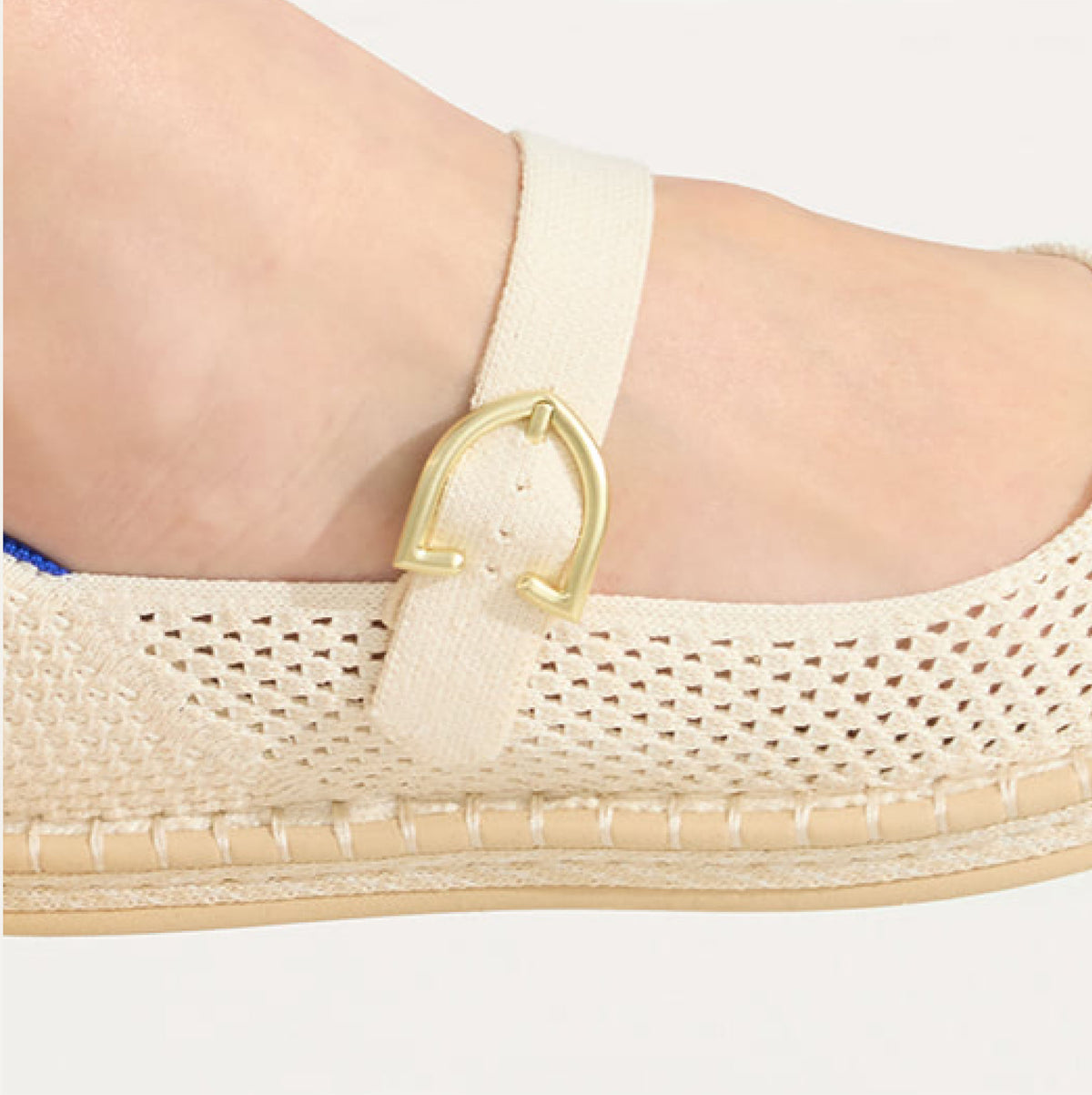 Close up of the buckle closure on The Espadrille Mary Jane. 