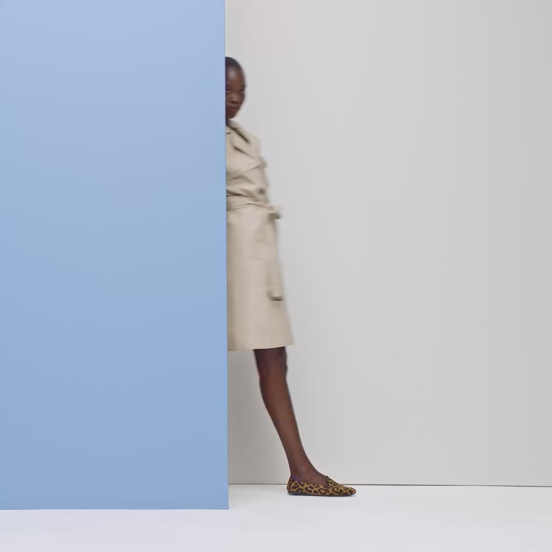 Model walking in The Almond Loafer in Classic Leopard and showing different angles of the shoes.